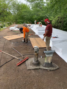 Professional roofing team performing commercial roof maintenance and inspection in Atlanta