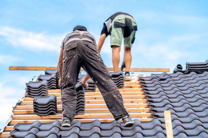 A trained crew performing roof installation ensures structural integrity, proper sealing, and long-term durability for demanding commercial roofing environments.