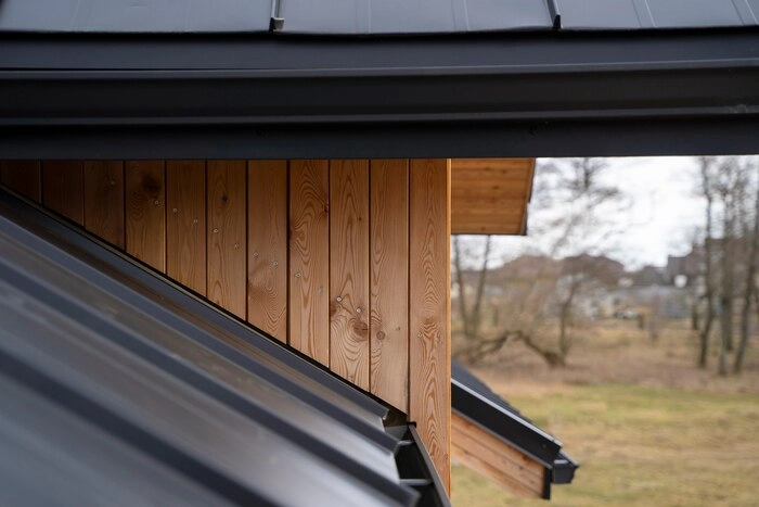 A metal roof on a wooden building