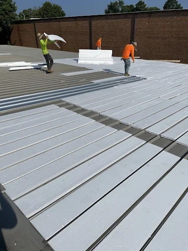 Roofers working on a roof