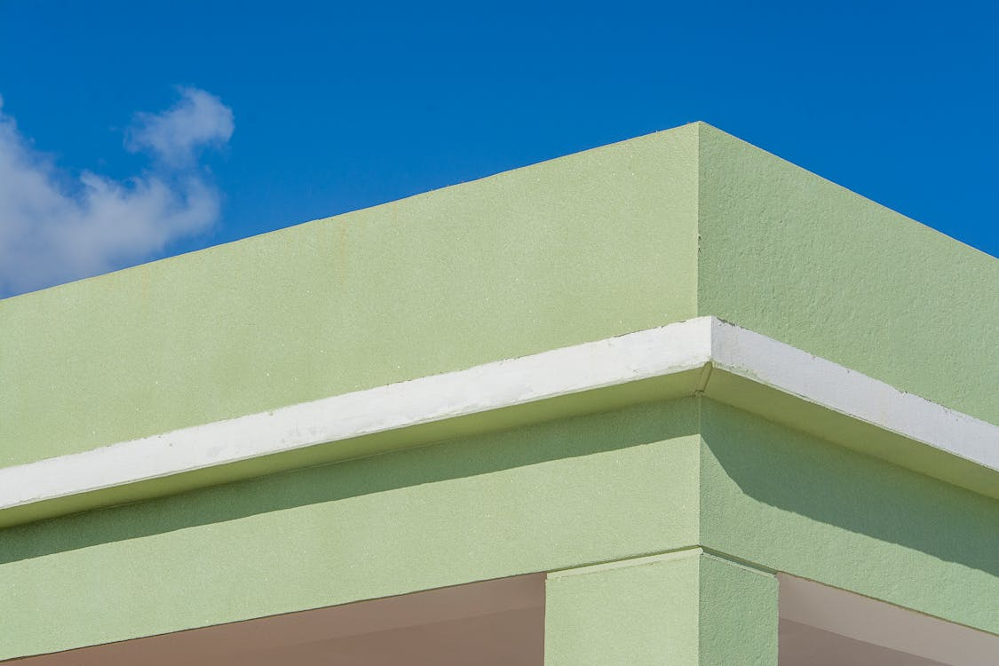 A photo showing the roof of a building with green paint.
