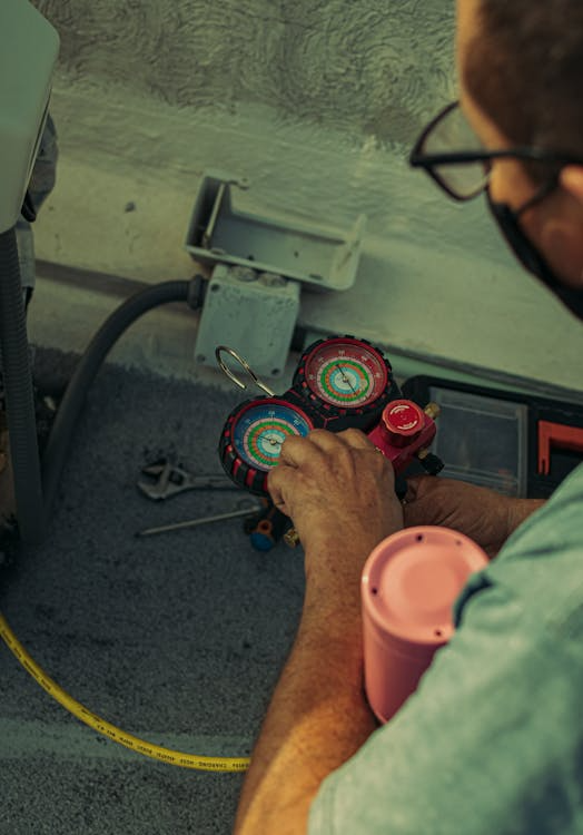 roof inspector checking flashing details around an HVAC unit