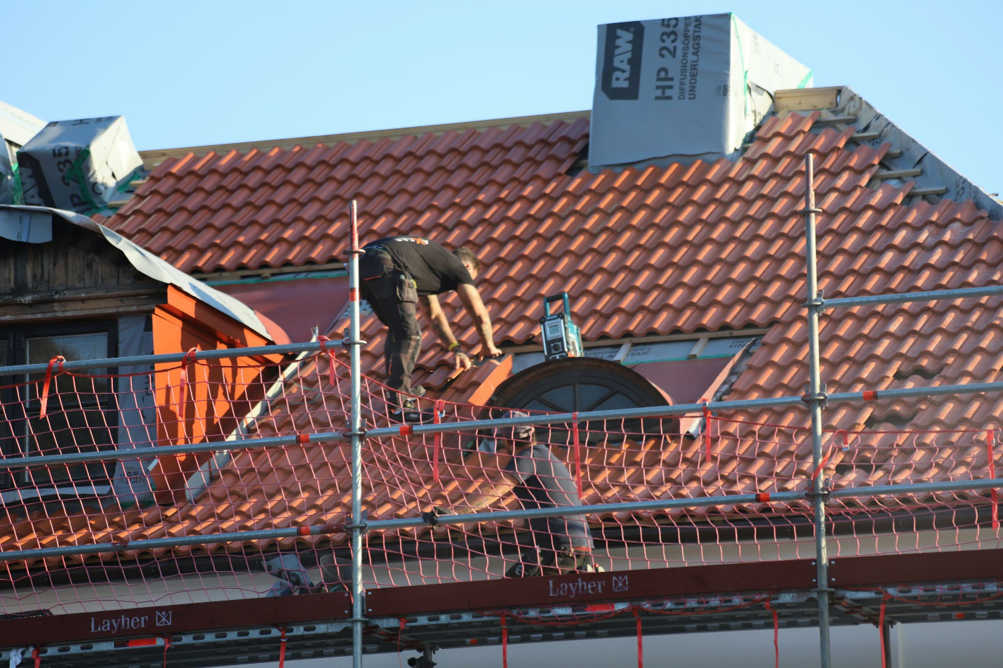 Roofing crew installing a new residential roof