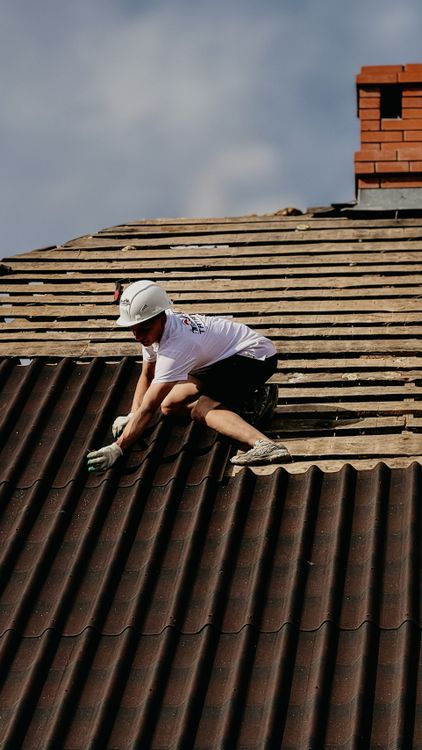 a worker working on roof maintenance