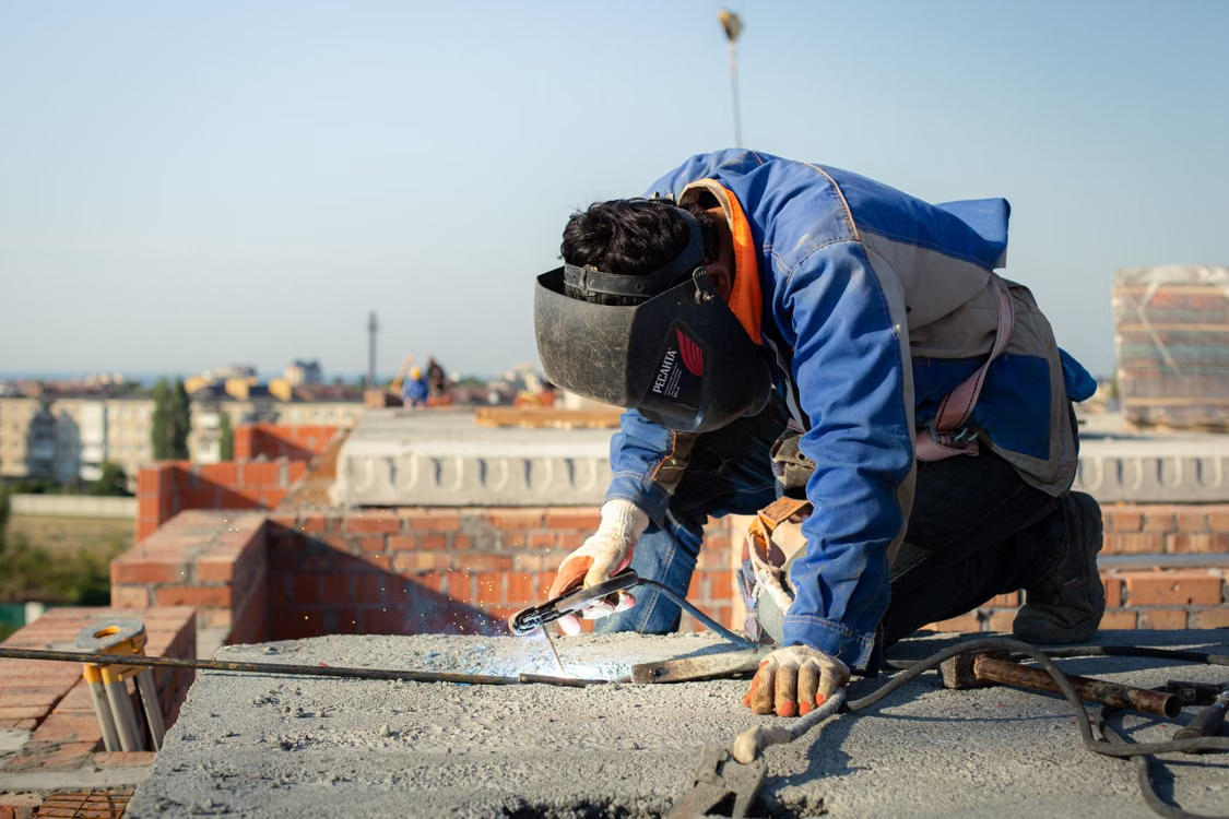 a man working on top of a roof